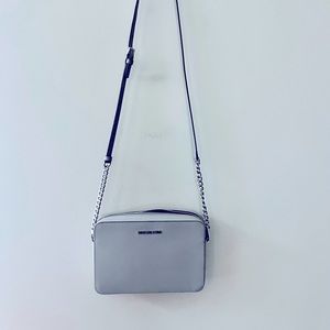 Completely new, never used Michael Kors crossbody bag.